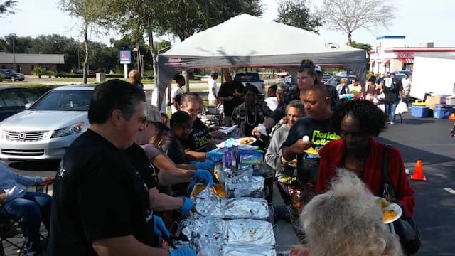 Living Message Church volunteers serving neighbors at a community meal.
